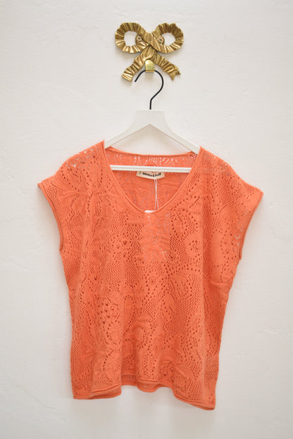 Misha & Puff coral openwork knit cap-sleeve top with V-neck, size 8–9, on hanger against neutral wall.