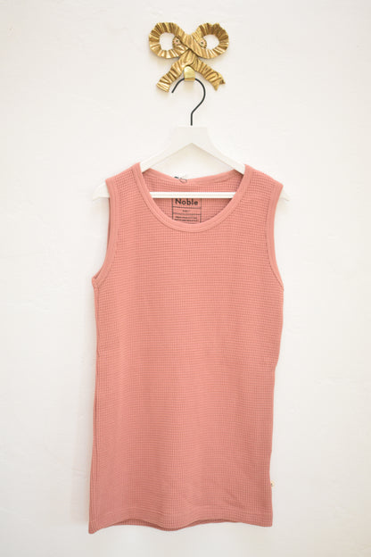 Noble kids dusty-rose waffle knit tank and shorts set, size 7, new with tags, on hanger against neutral wall.
