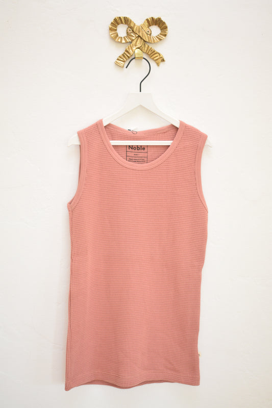 Noble kids dusty-rose waffle knit tank and shorts set, size 7, new with tags, on hanger against neutral wall.