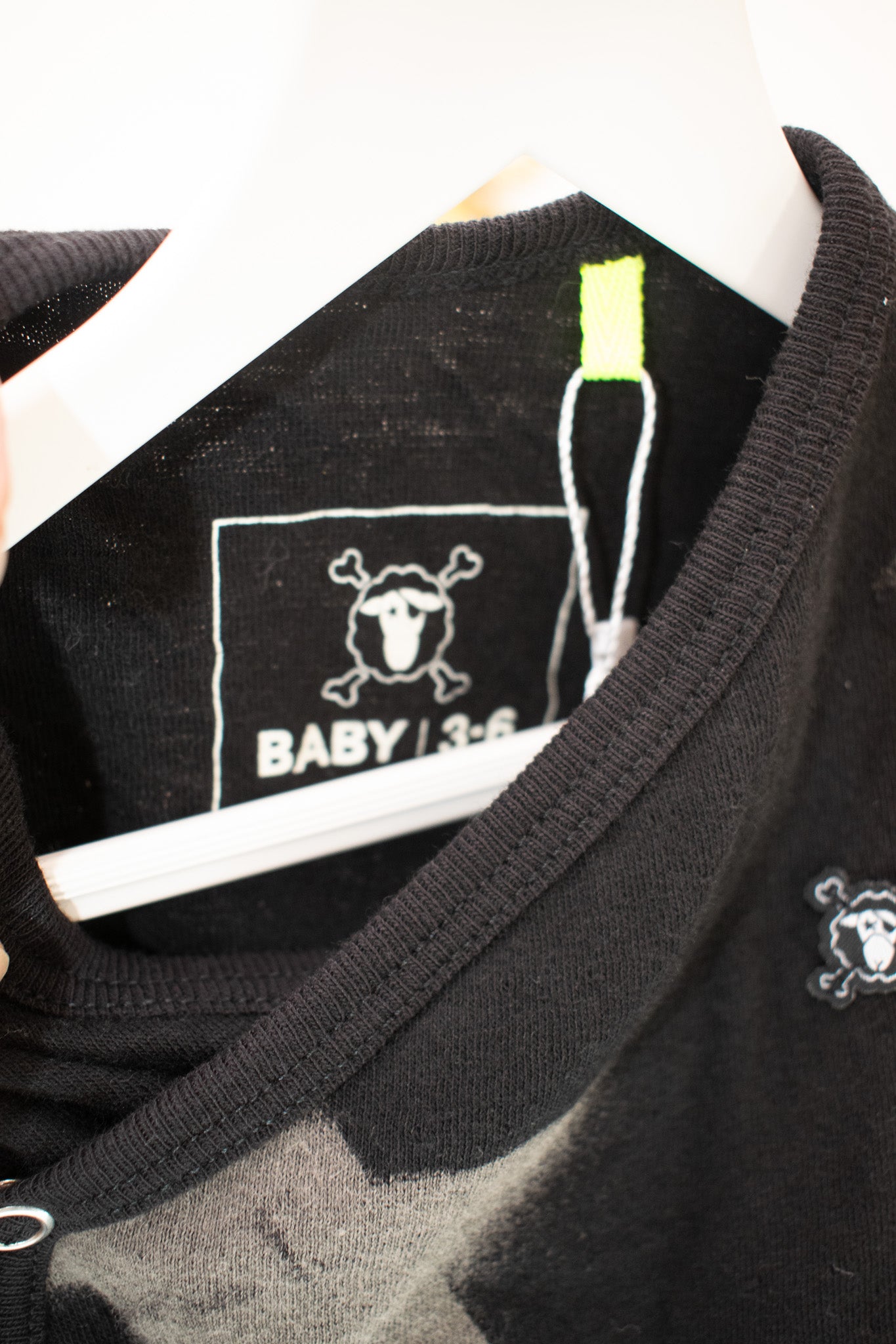 Nununu Black Star Onesie / 3-6 months